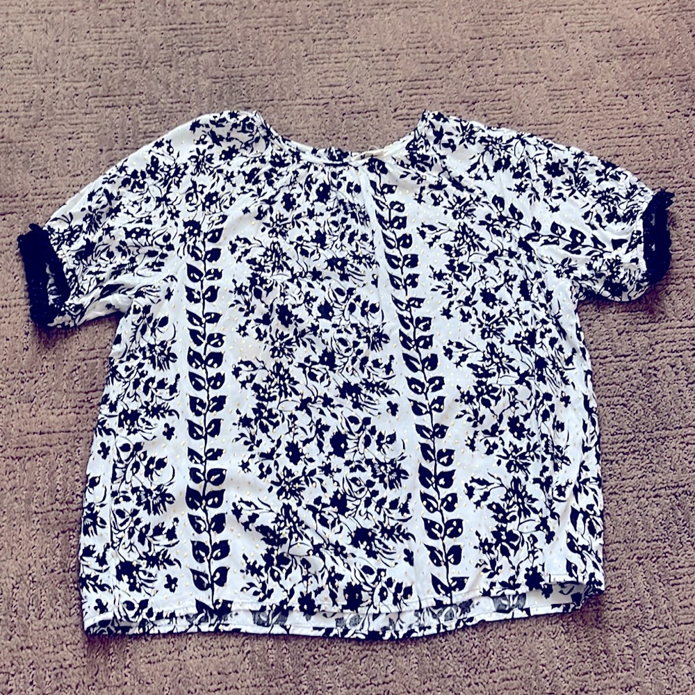 Black/white top with gold accents